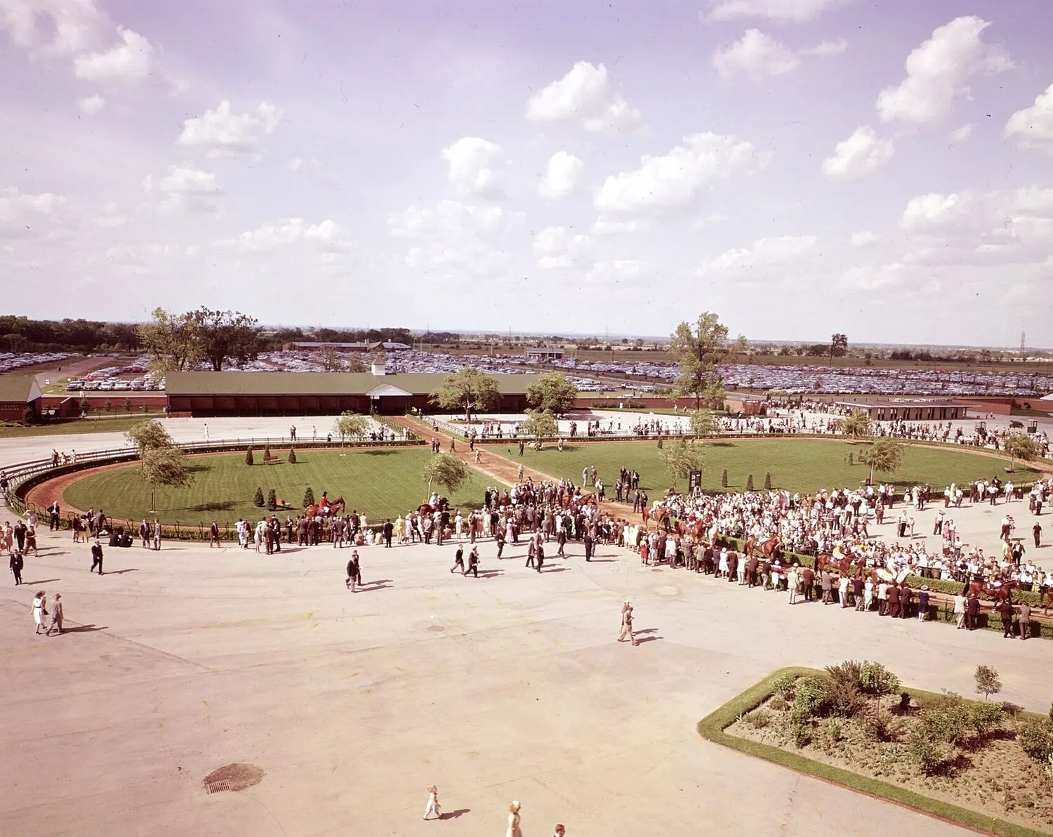 Elevated view of the Woodbine walking ring and grounds with a large crowd on a race afternoon